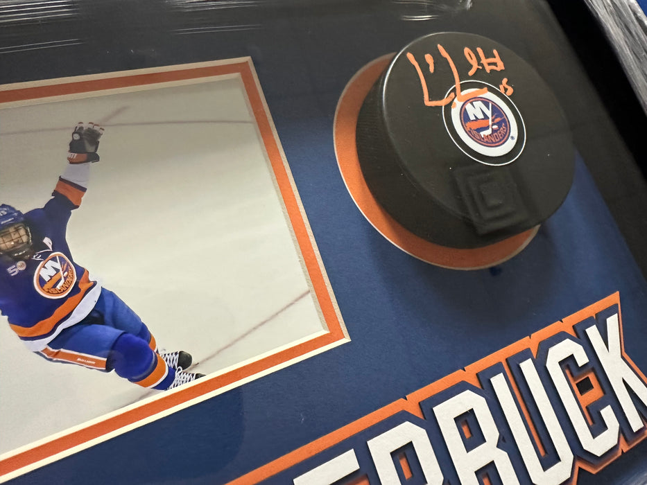 Cal Clutterbuck Autographed Puck in 13”x8” Custom Shadowbox (Fanatics)