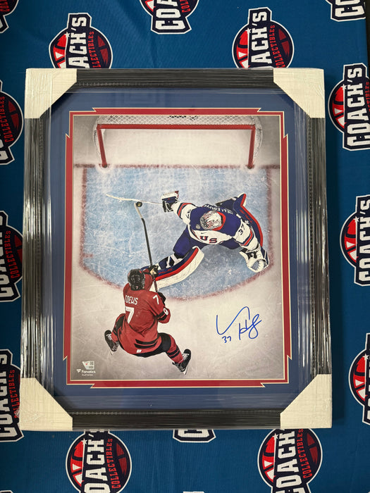 FRAMED Connor Hellebuyck Autographed Team USA 16" x 20" 2026 Winter Olympics “Save of the Year” Photograph (Fanatics)