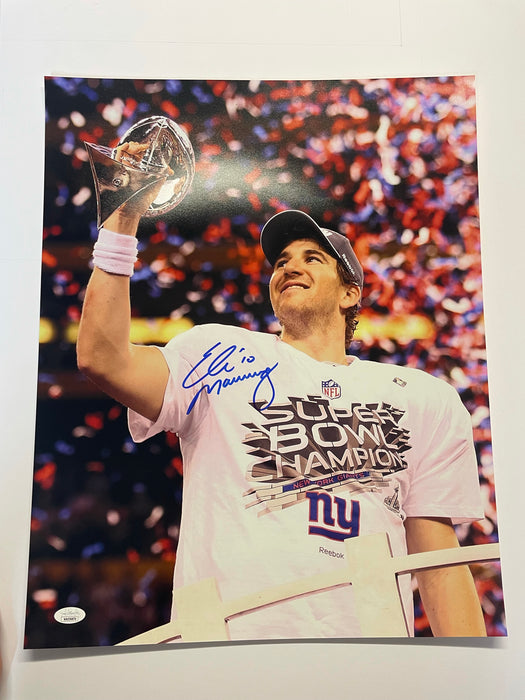 Eli Manning Autographed Super Bowl Trophy 16x20 Photo (JSA)